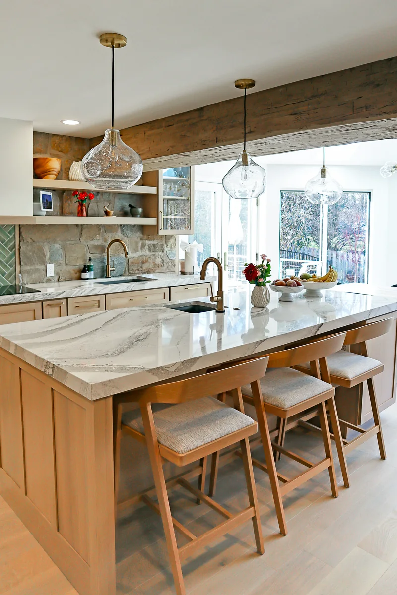 Large quartz kitchen island with seating in a Newtown Square remodel.